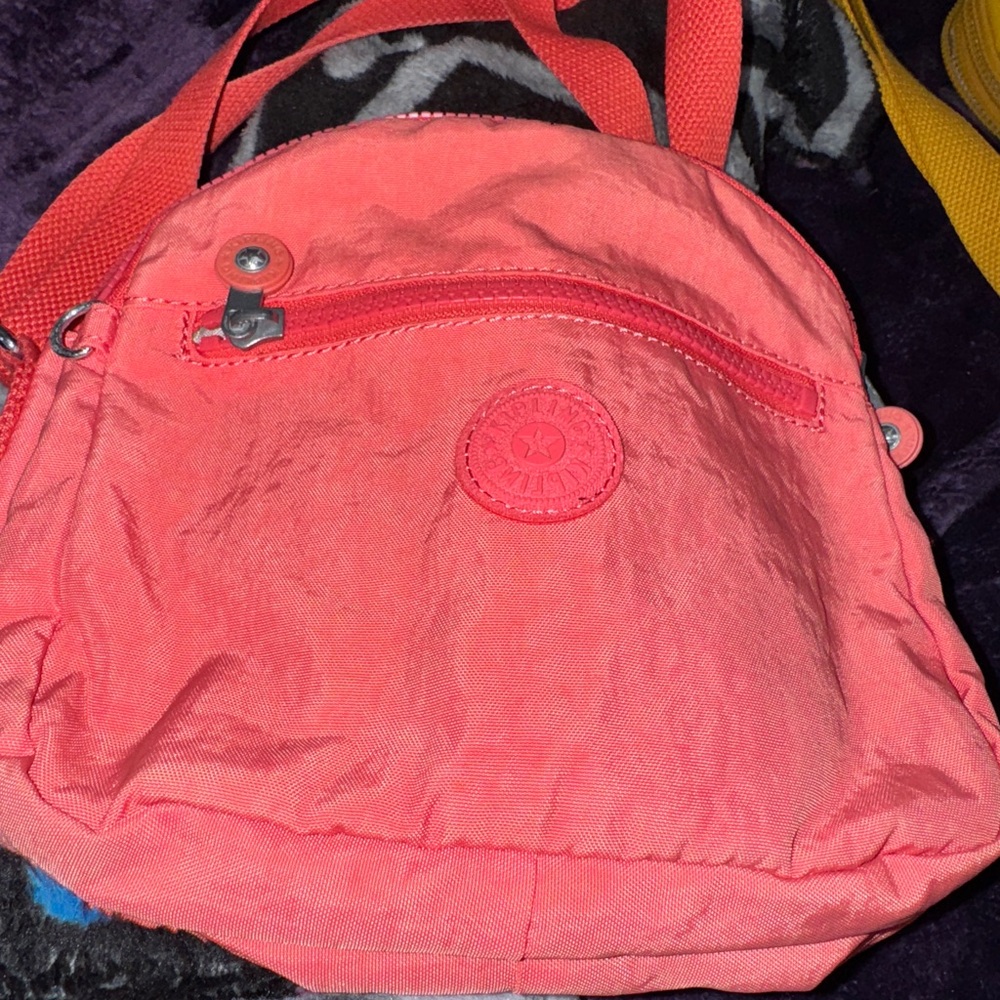 Kipling Vibrant Pink Backpack with Textured Fabric and Circular Logo